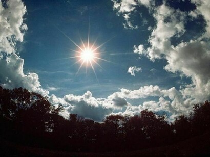 The sun, shining bright in the sky