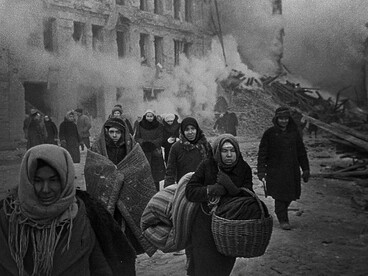 After the  bombing, citizens of Leningrad leaving their homes destroyed during German air raids in 1942, Soviet Union