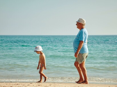 Elderly person with a child at the beach: it is fascinating to consider cross-programming as a way to bring about unforeseen interactions in the built environment