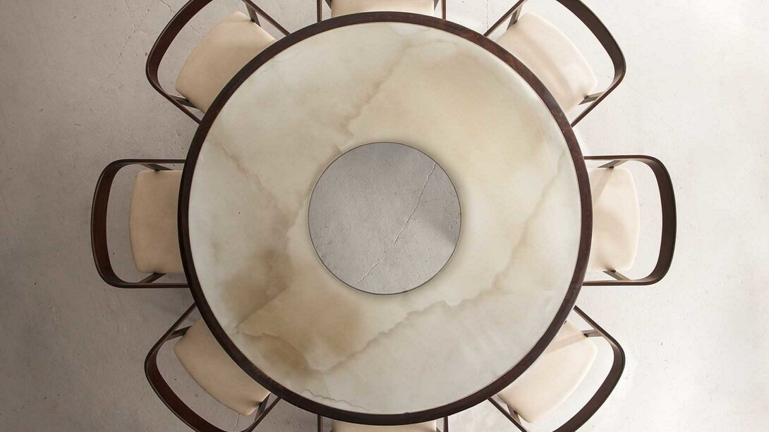 Round Dining Table and Curved Back Chairs by Joaquim Tenreiro at R & Company