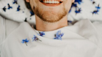 A happy man, smiling, in a good mood and good mental health condition, at peace