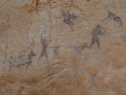 Moving with archers defending livestock scene in Tassili n'ajjer park in Djanet in Algeria
