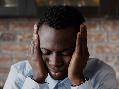 The somber look on his face reveals the painful consequences of a system that enforces silence over self-expression, leaving men without the tools to seek help or share their feelings