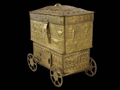 Decorated sheet-brass box, often used to carry shea butter or gold, richly decorated with symbolic designs such as a Sankofa bird, Ananse the spider and two crocodiles with one stomach. Collected c. 1900, Ghana. On display in West Africa: Word, Symbol, Song and courtesy of the Pitt Rivers Museum, University of Oxford