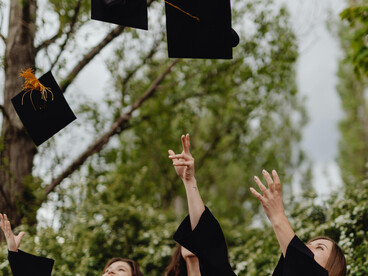University women graduates celebrating their achievement