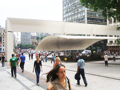 The cantilevered steel structure at São Paulo's Patriarch Plaza offers shelter and shade for the bus station, acting as a key landmark that connects the plaza to the underground mass transit system, as part of the revitalization project completed between 1992 and 2002