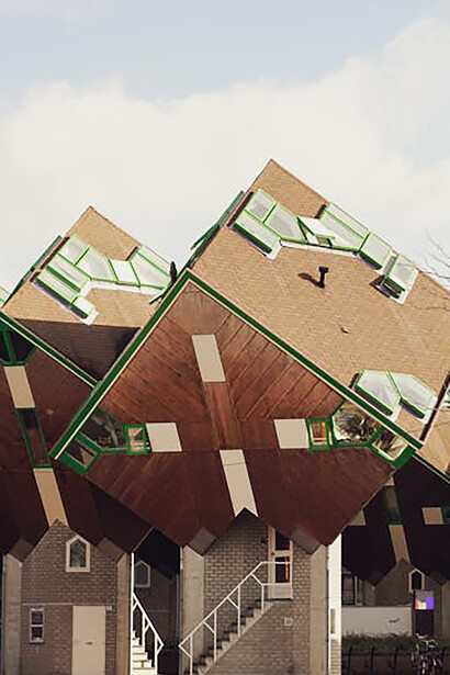 Designed by Piet Blom, the Cube Houses in Helmond started as a pilot with three units, later expanded to 18 stilt houses. This concept was later used in Rotterdam. The 18 cubes once formed a whole with Theater 't Speelhuis, which burned down in 2011