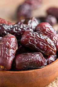 Enhance your culinary creations with a captivating display of Mejhool dates in a bowl