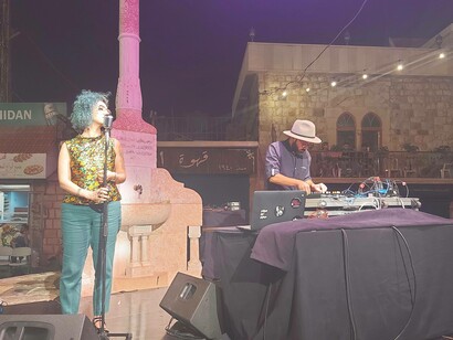Petra Hawi singing from the soul as stares into the crowd looking to connect with the audience from Hammana, Lebanon