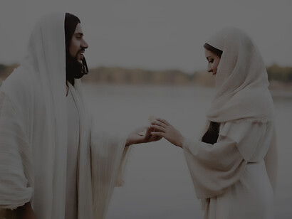 In a scene reminiscent of biblical times, a woman grasps for bread from the saint's hand