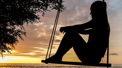 Suspended between light and shadow, she holds the weight of words unspoken: where friendship, longing, and restraint quietly meet