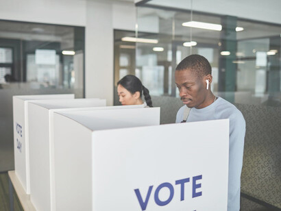 An African American man participating in the election by casting his vote