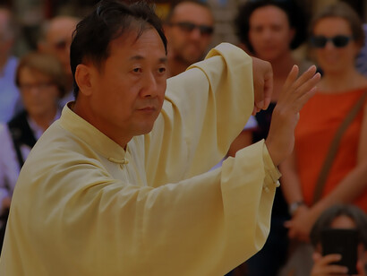 A Chinese man practicing Qigong for holistic well-being