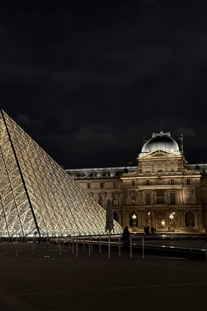 The Louvre Museum illuminated at night in Paris, France