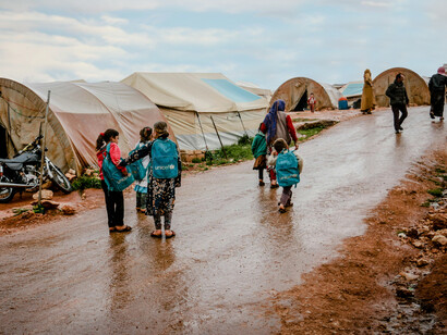 Refugees sheltering in an evacuation center in Idlib, Syria, endure poverty and harsh winter conditions 