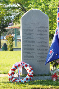 Australian service members stand before the 135th Assault Helicopter Company memorial in Veterans Park on April 25, following the Anzac Day ceremony honoring the Australian and New Zealand Army Corps who fought at Gallipoli during World War I