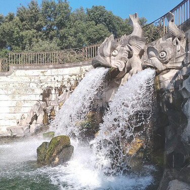 Commissioned by Charles of Bourbon and designed by Luigi Vanvitelli in the late eighteenth century, the Caserta monumental complex was built to rival Versailles and Madrid. It features the magnificent Royal Palace, its expansive gardens and park, a wooded area, the Carolino Aqueduct, and the San Leucio industrial district, renowned for its silk production