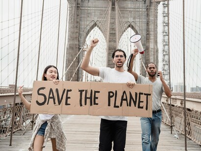 Demonstrators carrying signs for a healthier planet, reflecting public pressure for stronger climate policies