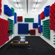 Haroon Mirza , Digital Switchover, 2012, Installation View, Kunst Halle Sankt Gallen, St.Gallen, 2012, 1 x control box, 4 x active speakers, 1 x relay, 1 x DVD player, 1 x TFT monitor, LEDs, foam. Courtesy the artist and Kunst Halle Sankt Gallen, Photo Gunnar Meier, © Haroon Mirza