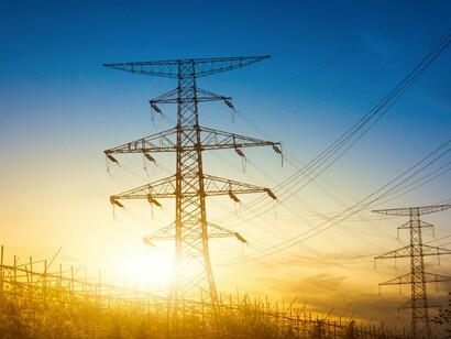 Electricity pylons carrying power across vast distances, reflecting the growing pressure on electricity networks worldwide