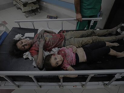 Following an Israeli airstrike on October 11, 2023, wounded Palestinians crowd the overwhelmed emergency ward at Gaza City's Al-Shifa Hospital, awaiting treatment