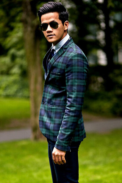 Wearing a Topman suit and Hugo Boss tie with Ray-Ban sunglasses