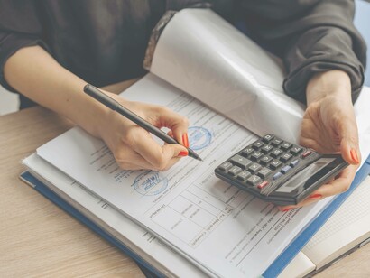 Woman prepares to file taxes
