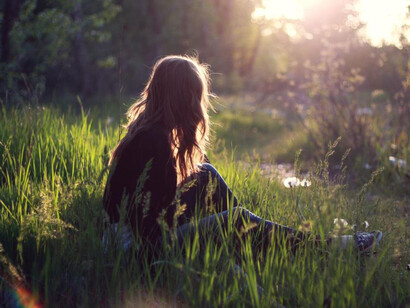 Lonely girl at sunrise