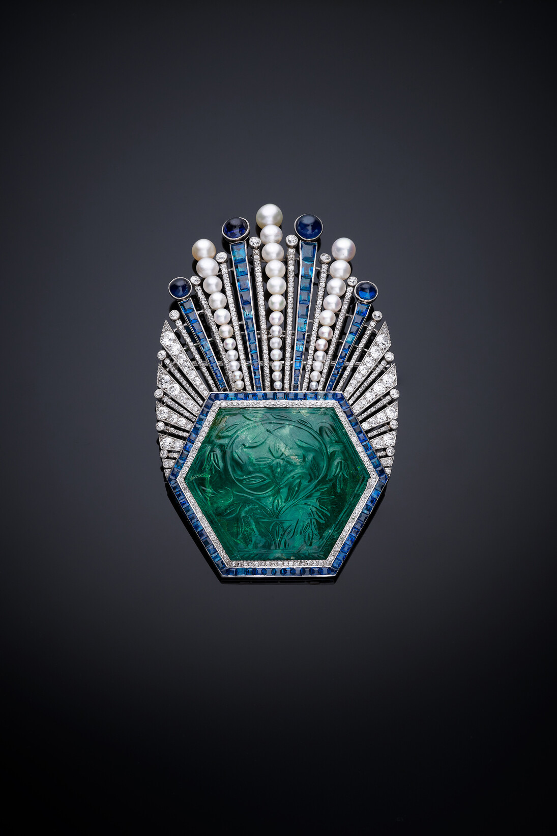 Aigrette, France, Paris, designed by Paul Iribe, made by Robert Linzeler, 1910, Platinum, set with emerald, sapphires, diamonds, and pearls, H. 3-5/8 in. (9 cm), W. 2-1/4 in. (5.6 cm), D. 5/8 in. (1.5 cm), Al-Thani Collection. Image: © Servette Overseas Limited 2013. All rights reserved.
