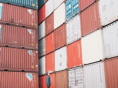 Man observing shipping containers