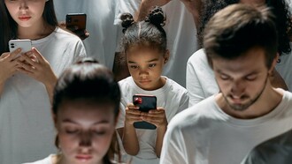 Young couple addicted to their phone screens