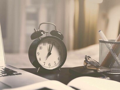 An alarm clock in an office to indicate that time is money