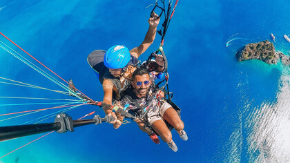 A man paragliding on vacation in Fethiye, Muğla, Turkey