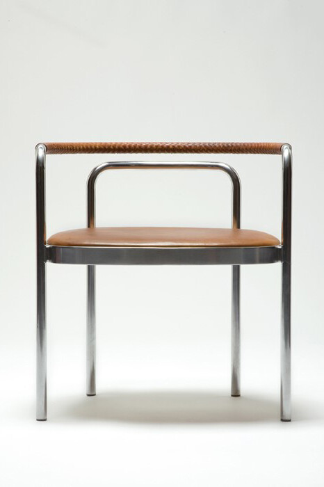 Poul Kjærholm, PK 12 chair with hand braided brown leather armrest and stainless steel frame, Seat upholstered in brown leather. Originally designed by Poul Kjaerholm, 1964. Produced by Sean Kelly Gallery and R 20th Century, Denmark, 2007-2010. (Seat height: 17.5") 19" L x 25" W x 27" H. Photo: Sherry Griffin © Poul Kjaerholm. Courtesy: Sean Kelly, New York with R & Company, New York