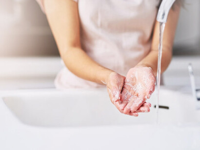 A woman obsessing over washing her hands continuously, OCD, it makes hands scarred by obsessive washing