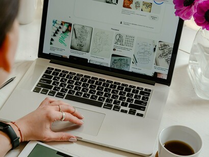 Person looking at digital art on a laptop