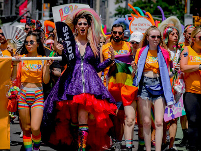 A group of people walking together during the Pride March in New York City, USA