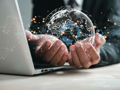 A businessman holding a global network connection, representing the integration of decentralized AI with blockchain technology