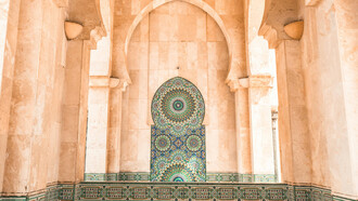 The stunning Moroccan tiles and intricate artistry of the mosque in Casablanca, Morocco, reflect the deep reverence Moroccans have for their sacred places during Ramadan, where spirituality and culture intertwine