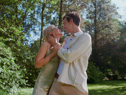 Beneath the trees, their embrace speaks volumes about the deep emotional bond that intertwines their hearts and minds