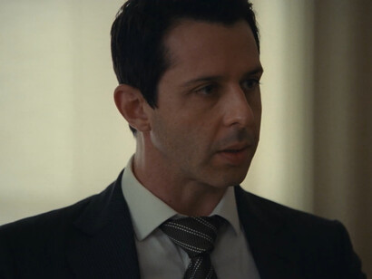 Kendall Roy looking troubled, symbolising his struggle between breaking free from Logan’s influence and repeating his father’s patterns in Succession