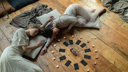 In a sacred space of candles and connection, women gather to visualise their dreams, aligning heart and mind with intention