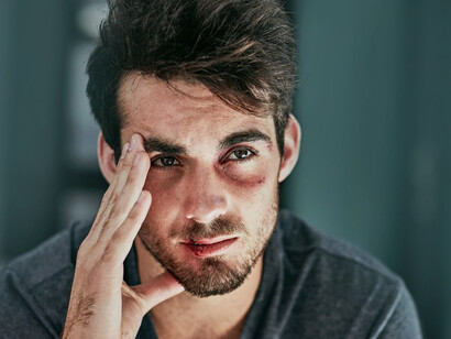 A man in emotional pain. By discouraging sadness, men learn to mourn in silence