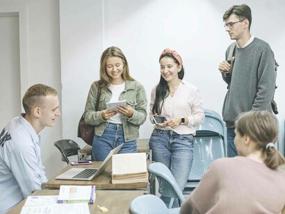 A group of students listening to the idea validation of their classmate