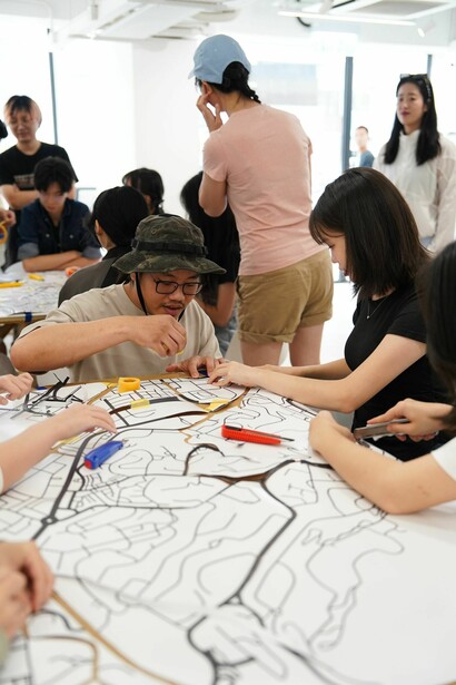 Students in Education lab exploring Mark Bradford’s Merchant posters, Hong Kong, 2024. Courtesy of Hauser & Wirth Gallery. Photo by Ivan Chan 