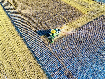 Milling tractor moving across a farm