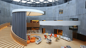 Discover the stunning atrium of the Oscar Niemeyer Library located inside the Petit Volcano in Le Havre