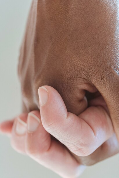 People holdings hands to demonstrate connection