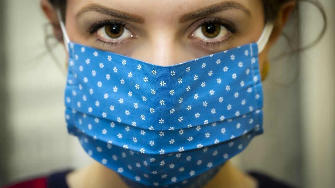 A masked woman stared the coronavirus pandemic crisis in the eyes as she tackled her day
