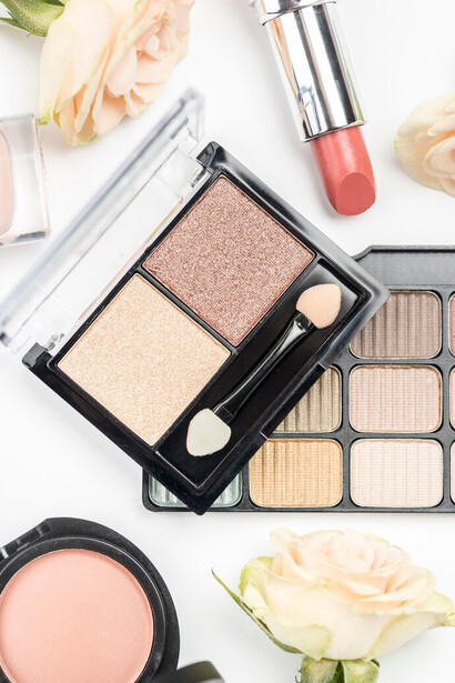 Top view of various makeup textures showcasing beauty trends